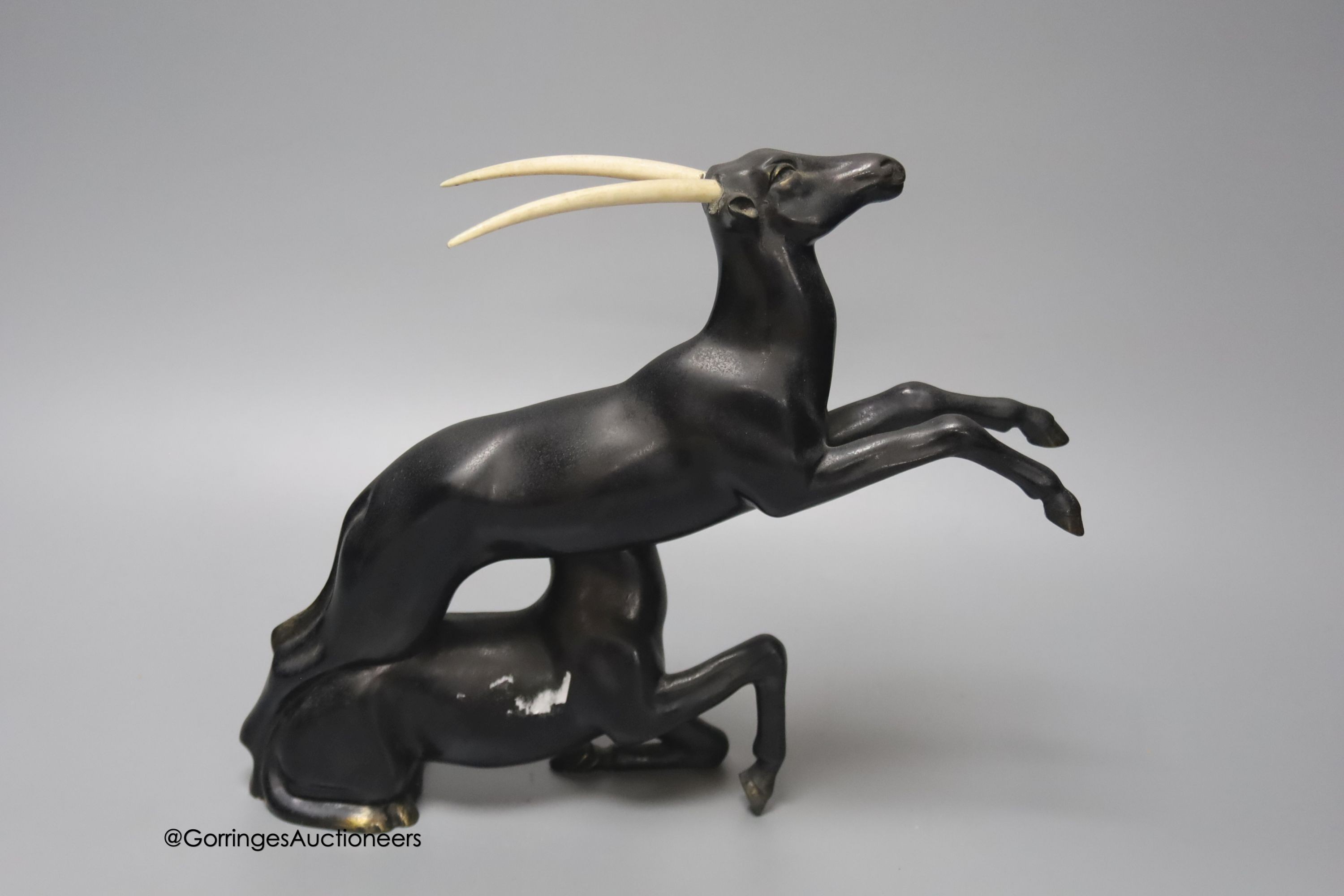 A painted bronzed spelter and ivorine antelope, in the style of Raoh Schorr, height 24cm